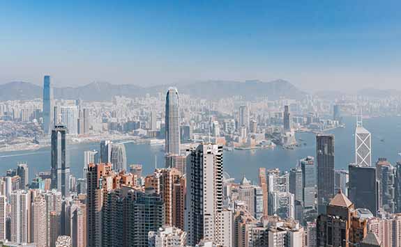 Skyline in Hong Kong in the daytime on a clear sunny day. 